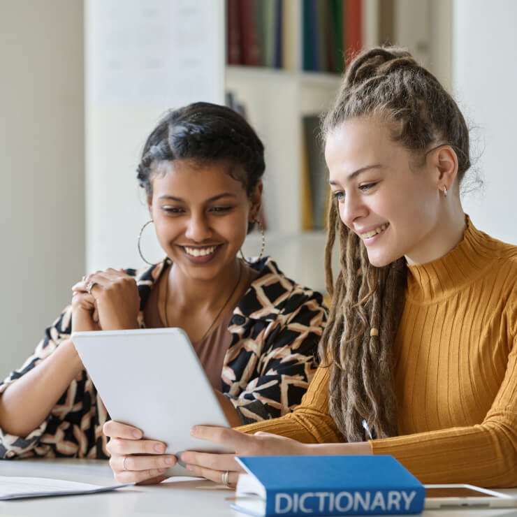 Students learning with tablet at language institute